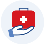 Hand holding a red First Aid kit.