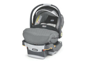 A Chicco brand infant detachable carrying car seat with a handle and cover, in shades of gray, black and white.