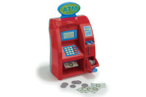 Kids' red play ATM machine with toy dollars and coins.