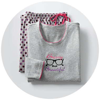 Women's grey PJ set with polka dot bottoms and a top with embroidered glasses and text reading Bossy But Beautiful.